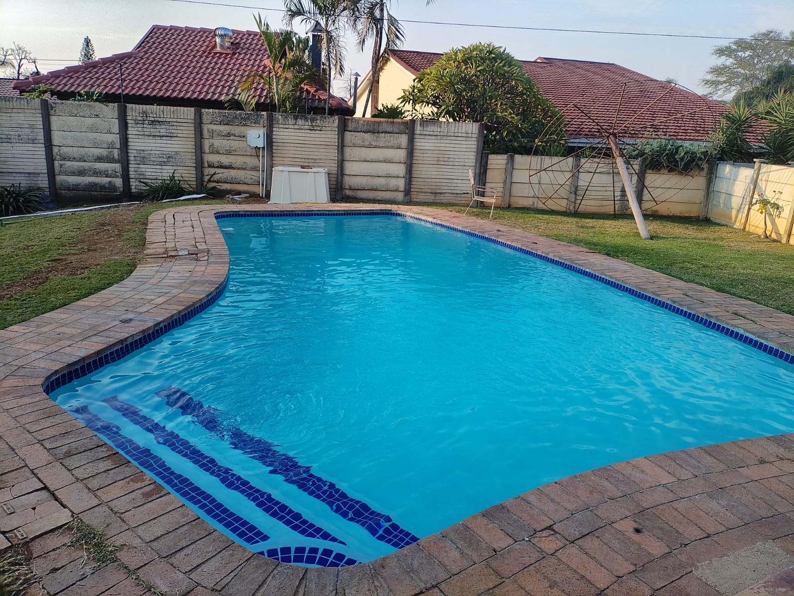 Completed swimming pool resurfacing with new mosaic tiling