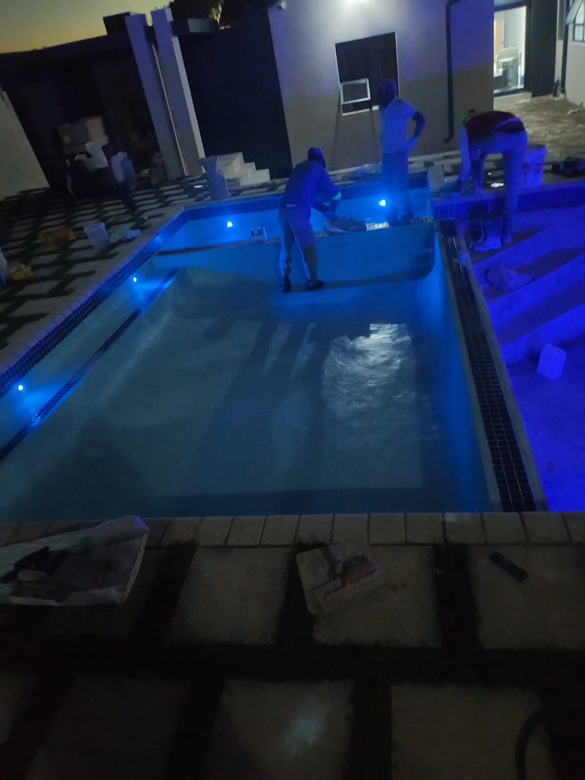 Pool with underwater LED lighting at dusk