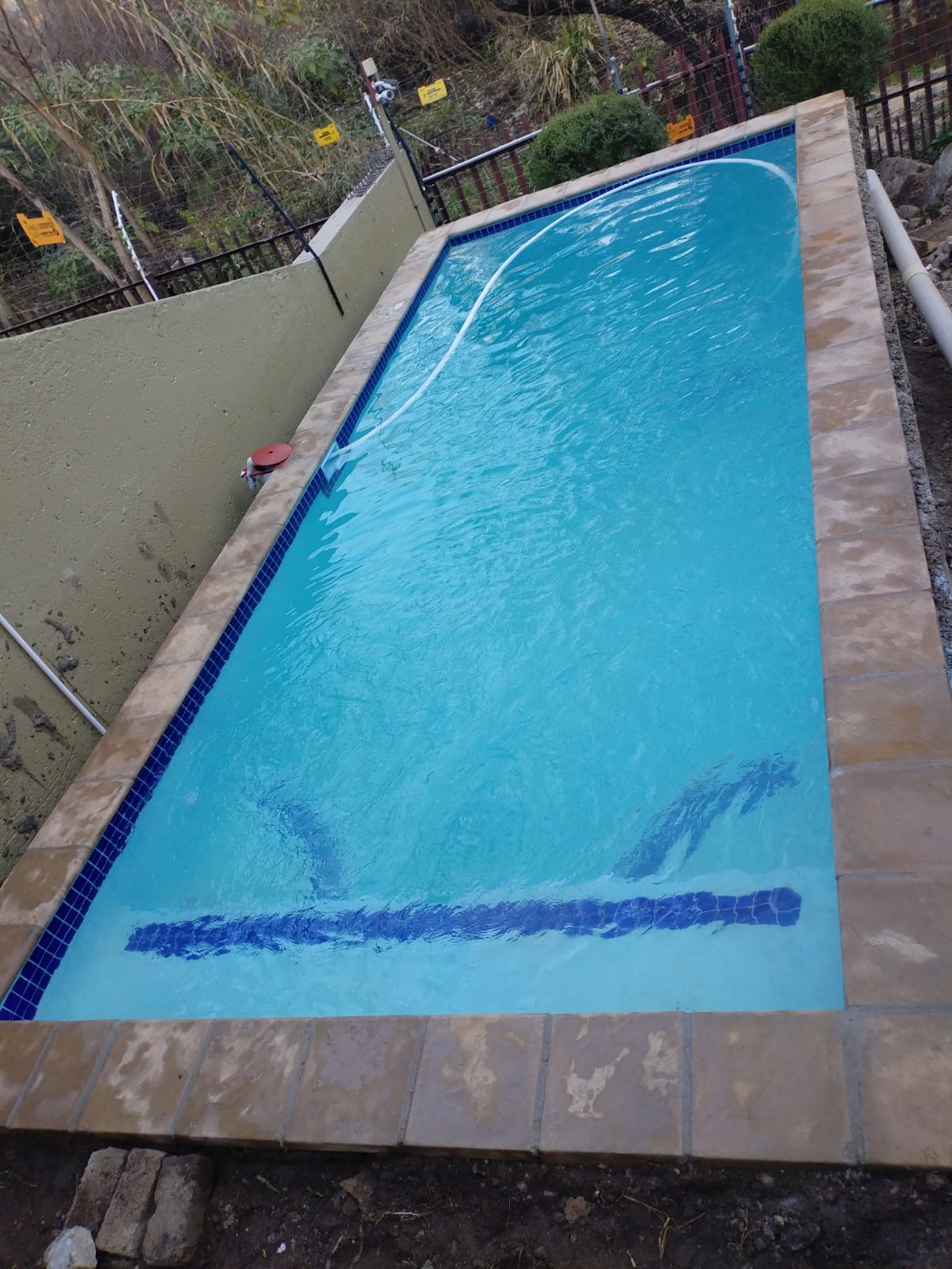 Finished pool on a sloped garden